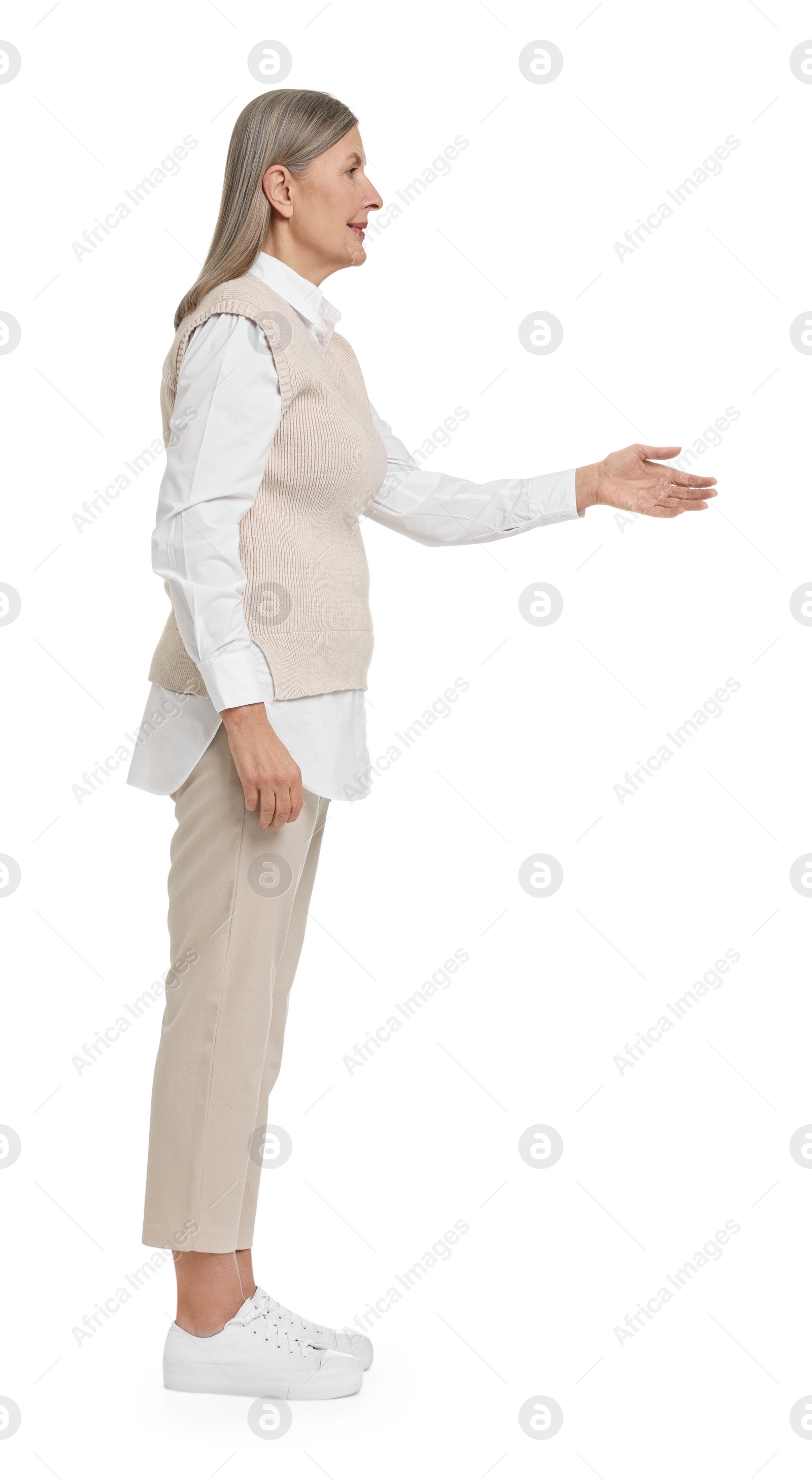 Photo of Senior woman greeting someone on white background