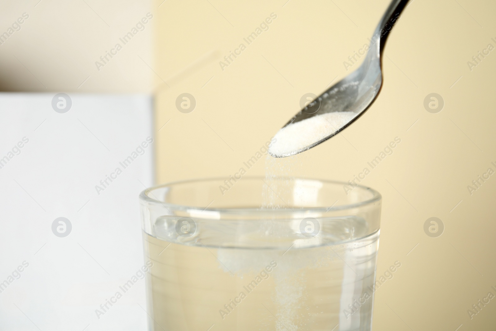Photo of Cold relief powder dissolving in water, closeup