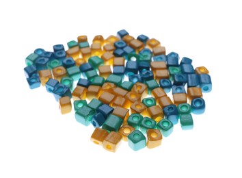 Photo of Pile of blue and yellow beads on white background