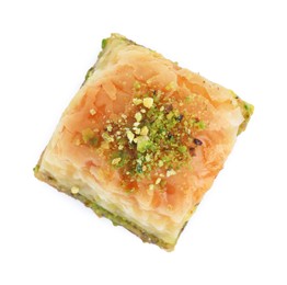 Piece of delicious fresh baklava with chopped nuts isolated on white, top view. Eastern sweets