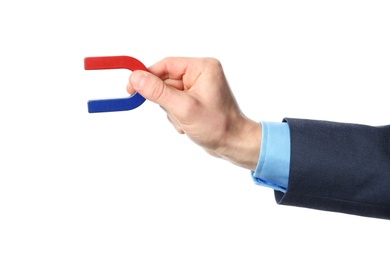 Photo of Man holding magnet on white background, closeup