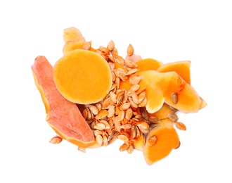 Photo of Pumpkin peel and seeds on white background, top view. Composting of organic waste