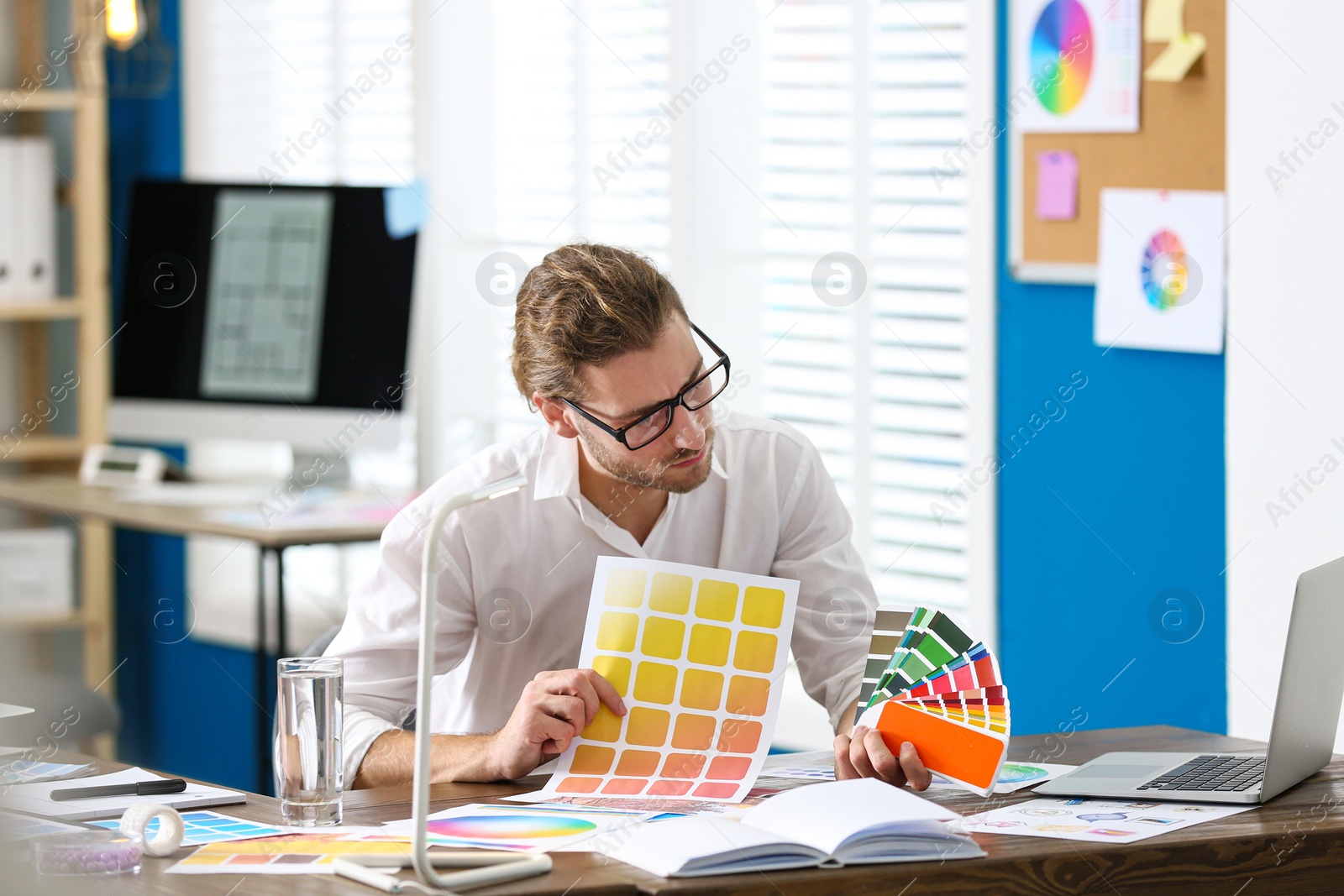 Photo of Professional interior designer at workplace in office