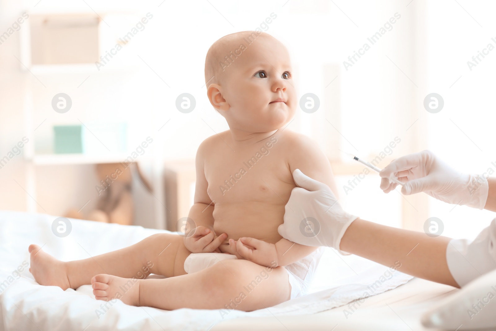 Photo of Doctor vaccinating baby in clinic