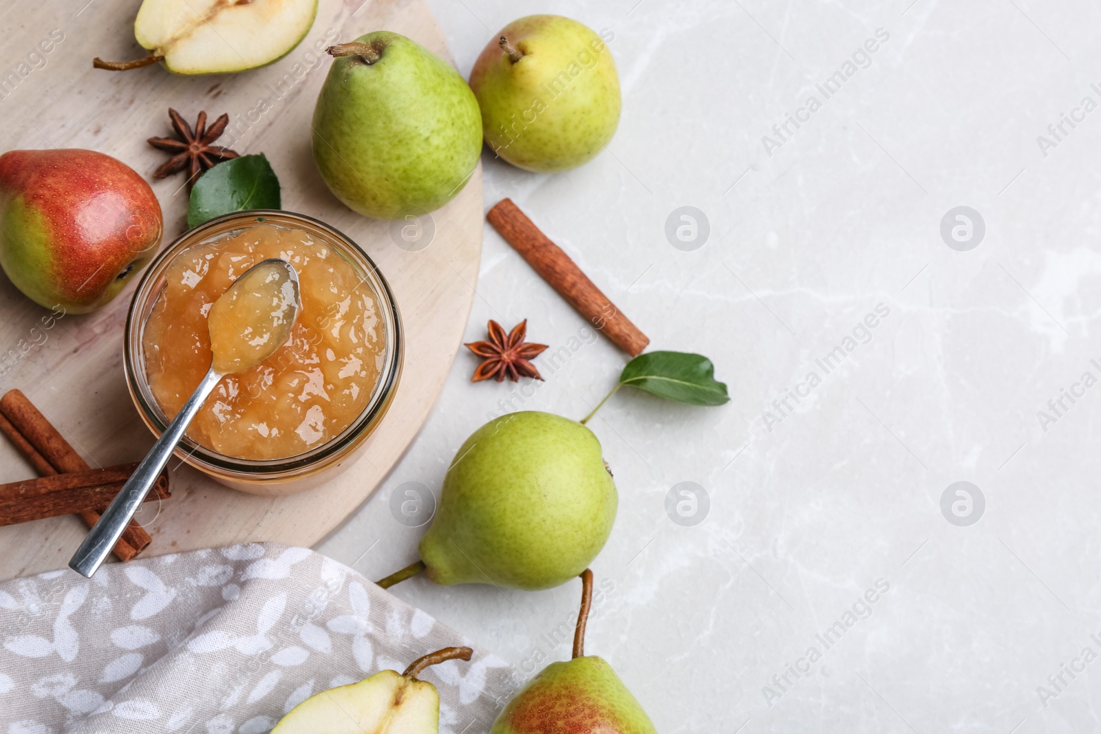 Photo of Delicious pear jam and fresh fruits on light grey table, flat lay. Space for text