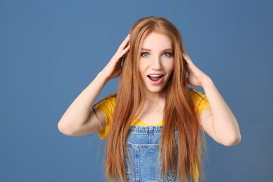 Photo of Portrait of young model with beautiful  hair on color background