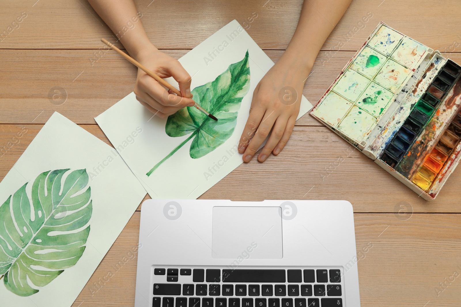 Photo of Woman drawing picture at online art lesson, top view. Distant learning