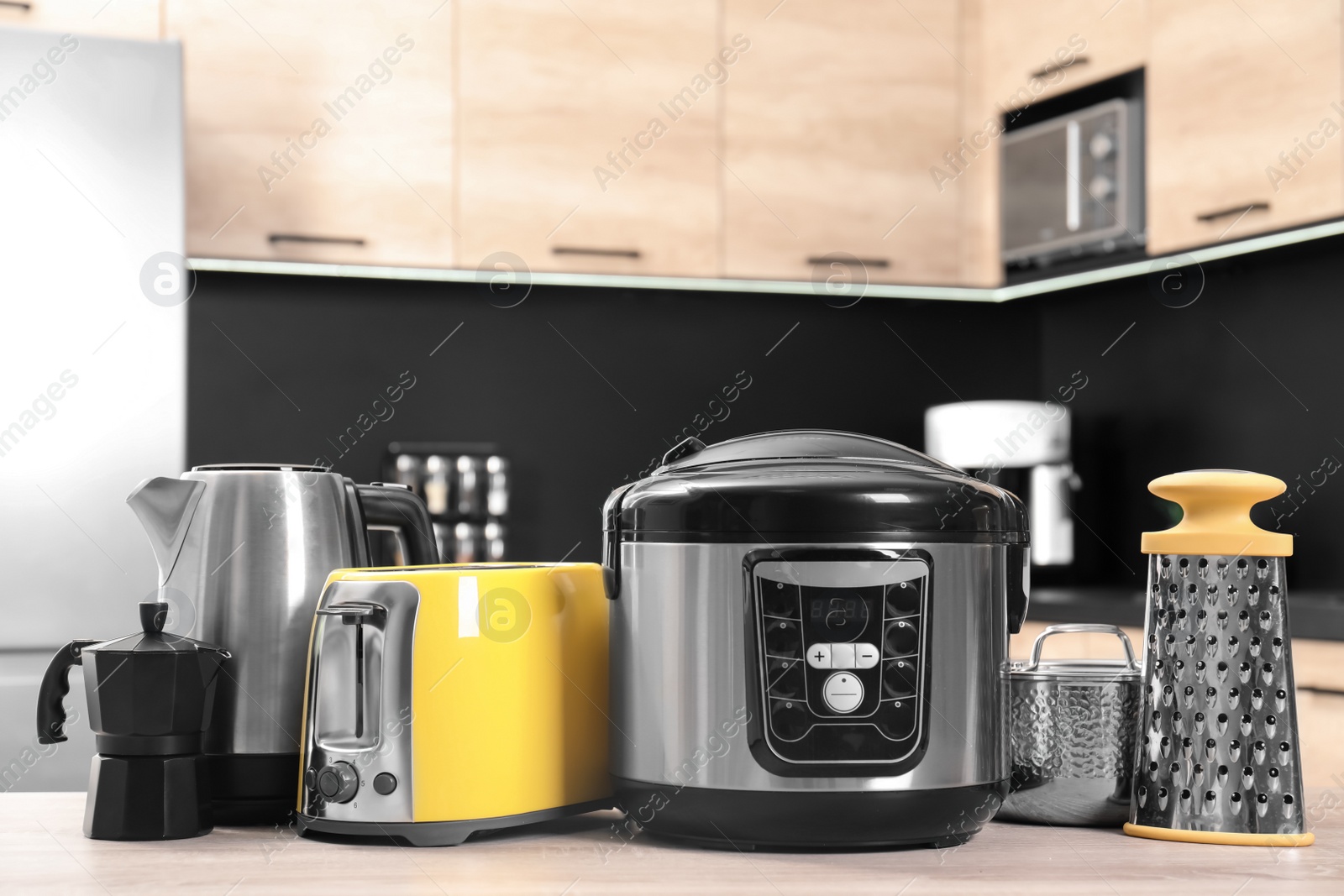 Photo of Set with modern domestic appliances in kitchen