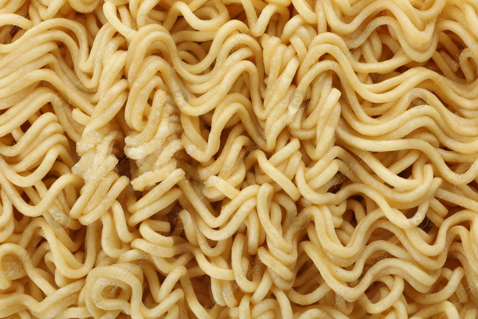 Photo of Quick cooking noodles as background, closeup view