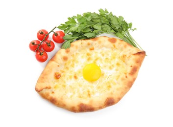 Photo of Fresh delicious Adjarian khachapuri, parsley and tomatoes on white background, top view