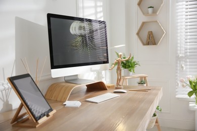 Stylish home office interior with comfortable workplace