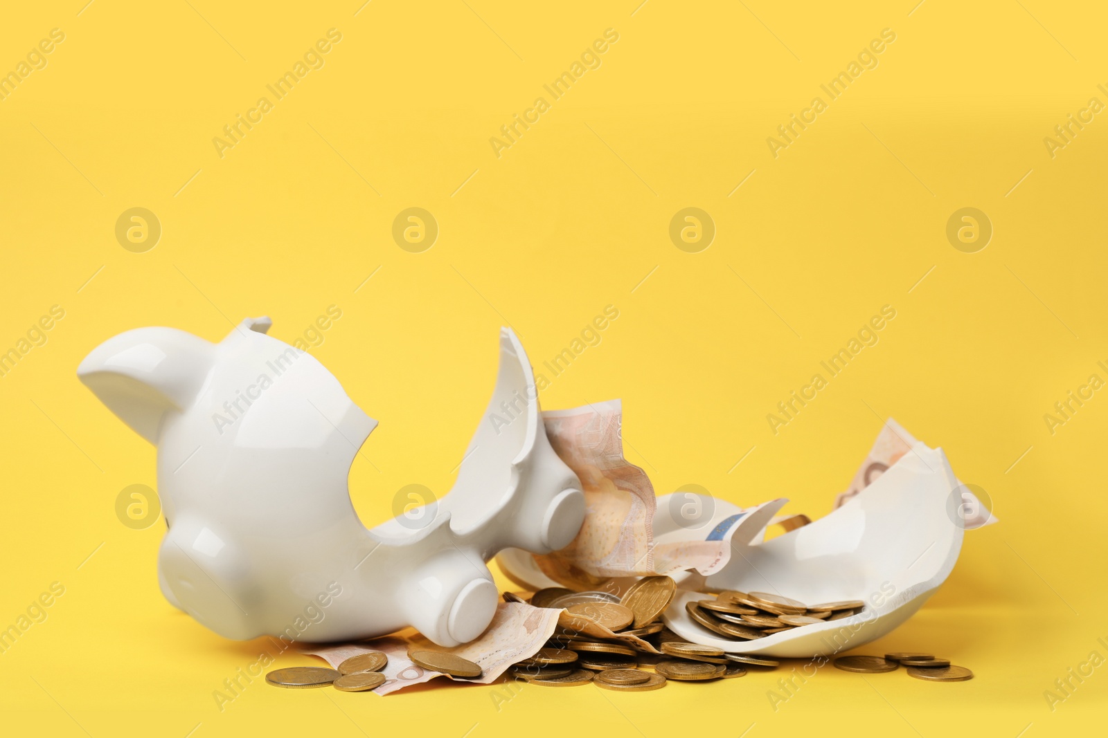 Photo of Broken piggy bank with money on color background