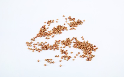 Photo of Uncooked buckwheat on white background. Healthy diet