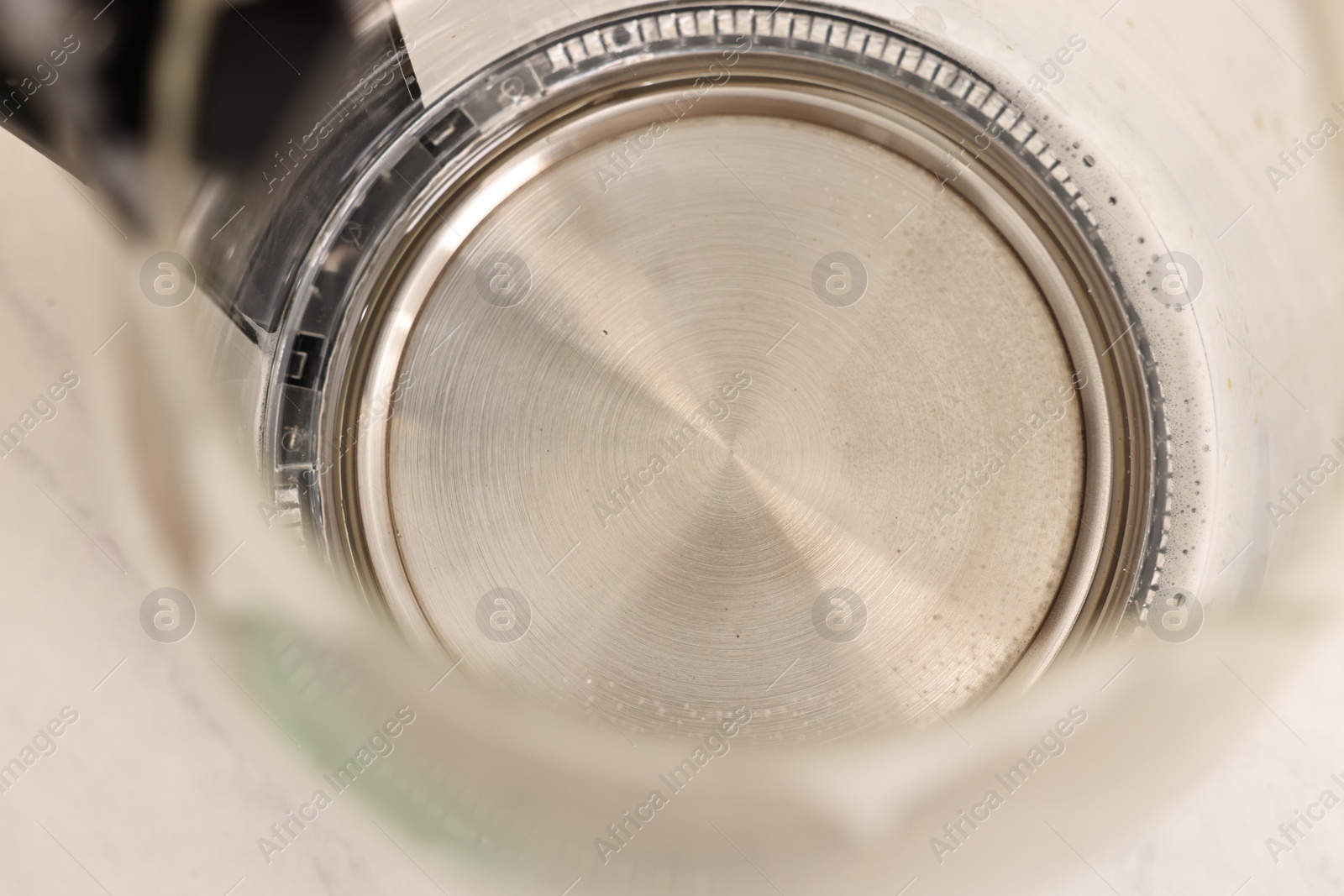 Photo of Cleaning electric kettle. Appliance with vinegar and baking soda on table, above view