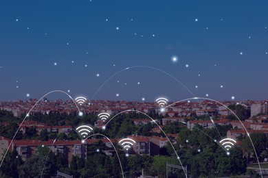 Image of Picturesque view of city with buildings and wi-fi symbols