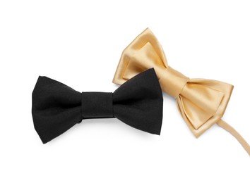 Different stylish bow ties on white background, top view