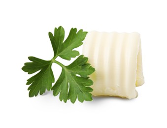 Tasty butter curl and fresh parsley isolated on white