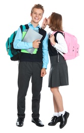 Photo of Pupils in school uniform gossiping on white background