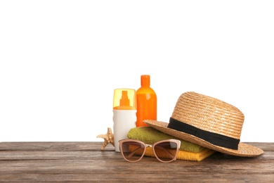 Photo of Set of different beach accessories on table against white background. Space for text