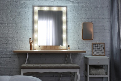 Photo of Dressing room interior with makeup mirror and table