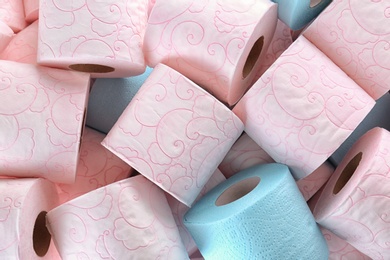 Photo of Many rolls of toilet paper as background. Personal hygiene