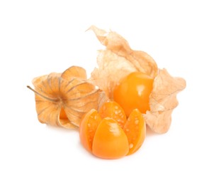 Photo of Cut and whole physalis fruits with dry husk on white background