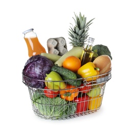 Shopping basket with grocery products on white background