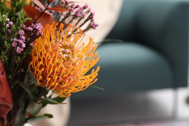 Photo of Bouquet of beautiful flowers in room, closeup. Space for text