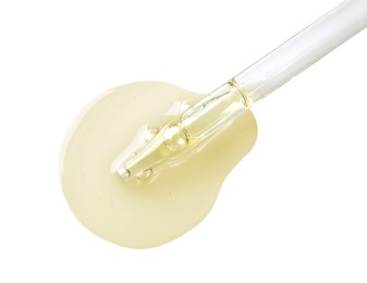 Image of Drop of hydrophilic oil from pipette on white background