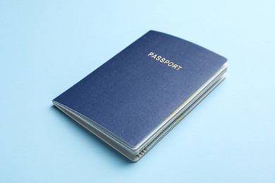 Blank passport on light blue background, closeup