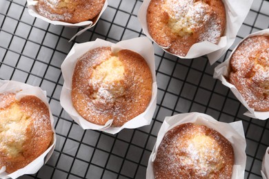 Photo of Delicious muffins on light table, flat lay