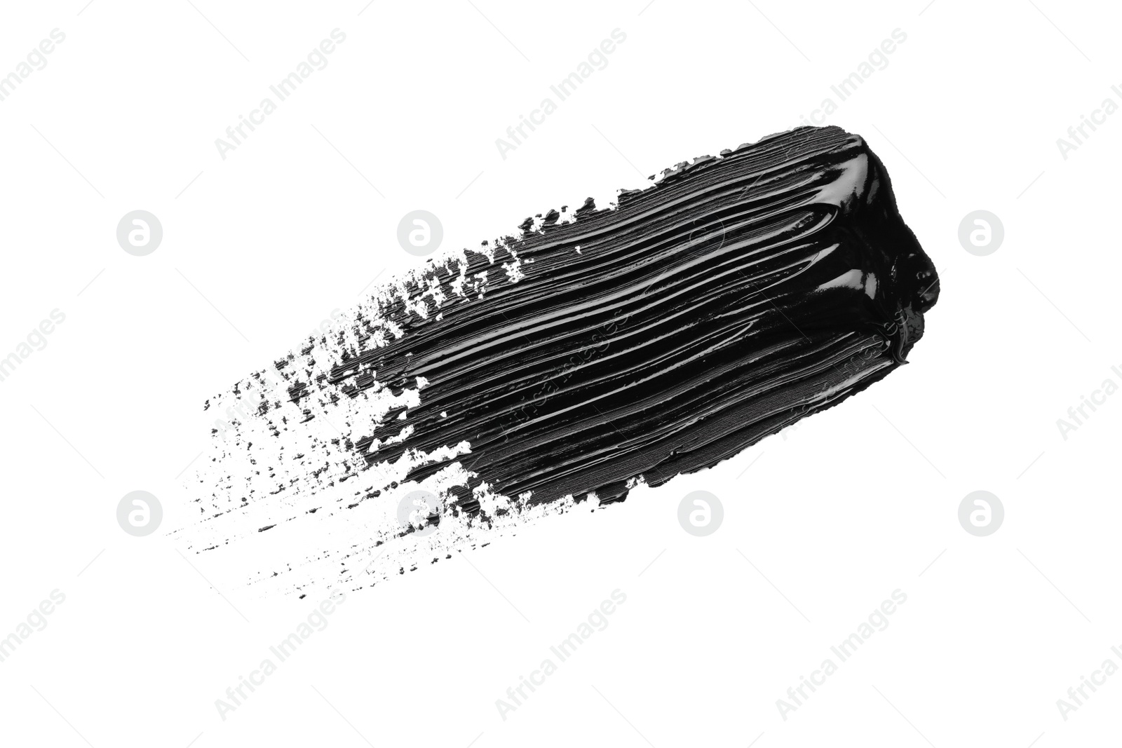 Photo of Brushstroke of black oil paint on white background, top view