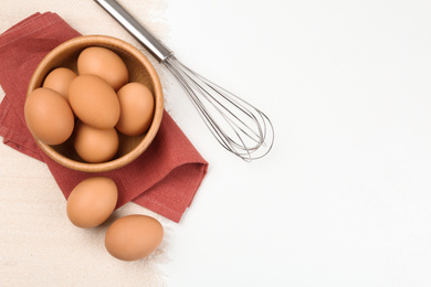 Photo of Flat lay composition with raw eggs on white table, space for text. Baking pie