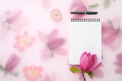 Photo of Guest list. Notebook, pen and magnolia on spring floral background, flat lay. Space for text
