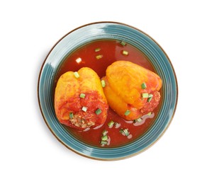 Plate with delicious stuffed peppers isolated on white, top view