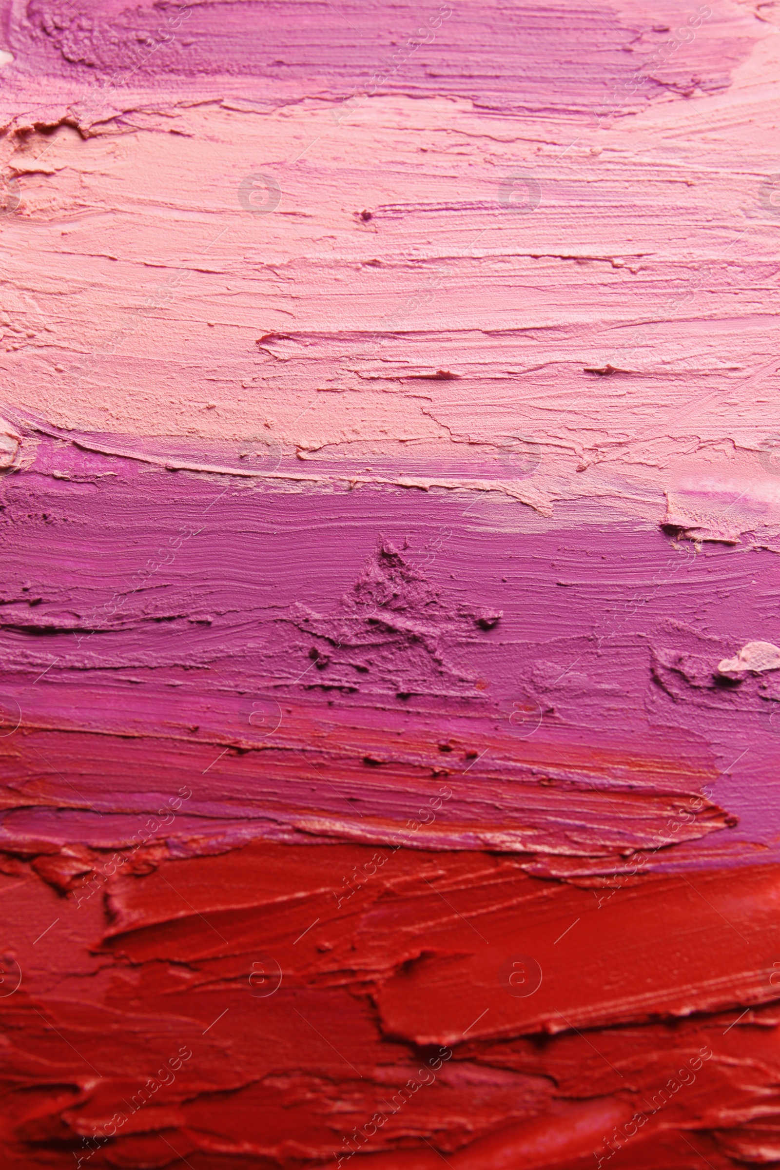 Photo of Strokes of lipstick as background, top view