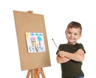 Child painting picture on easel against white background