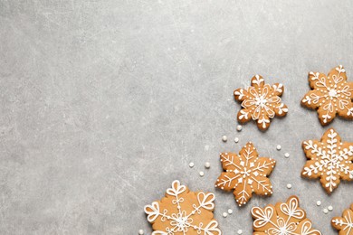 Photo of Tasty Christmas cookies on light grey table, flat lay. Space for text