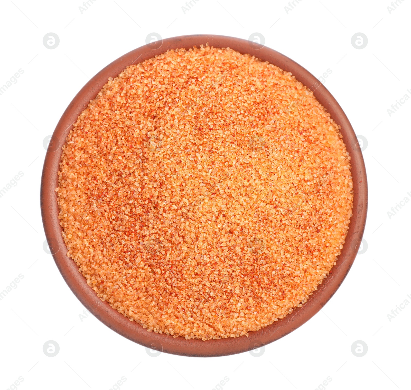 Photo of Orange salt in bowl isolated on white, top view