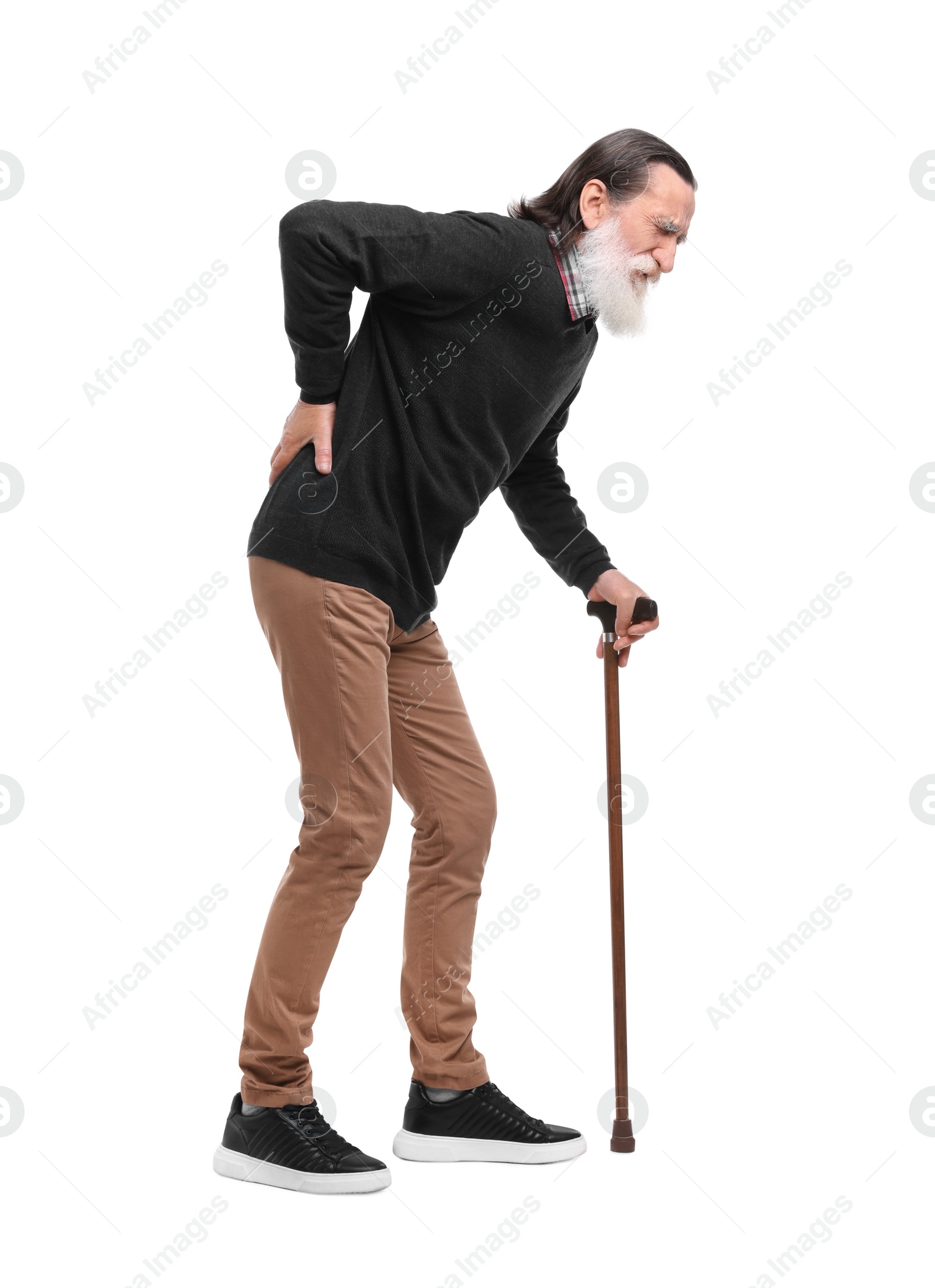 Photo of Senior man with walking cane suffering from back pain on white background