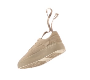 One stylish beige sneaker isolated on white