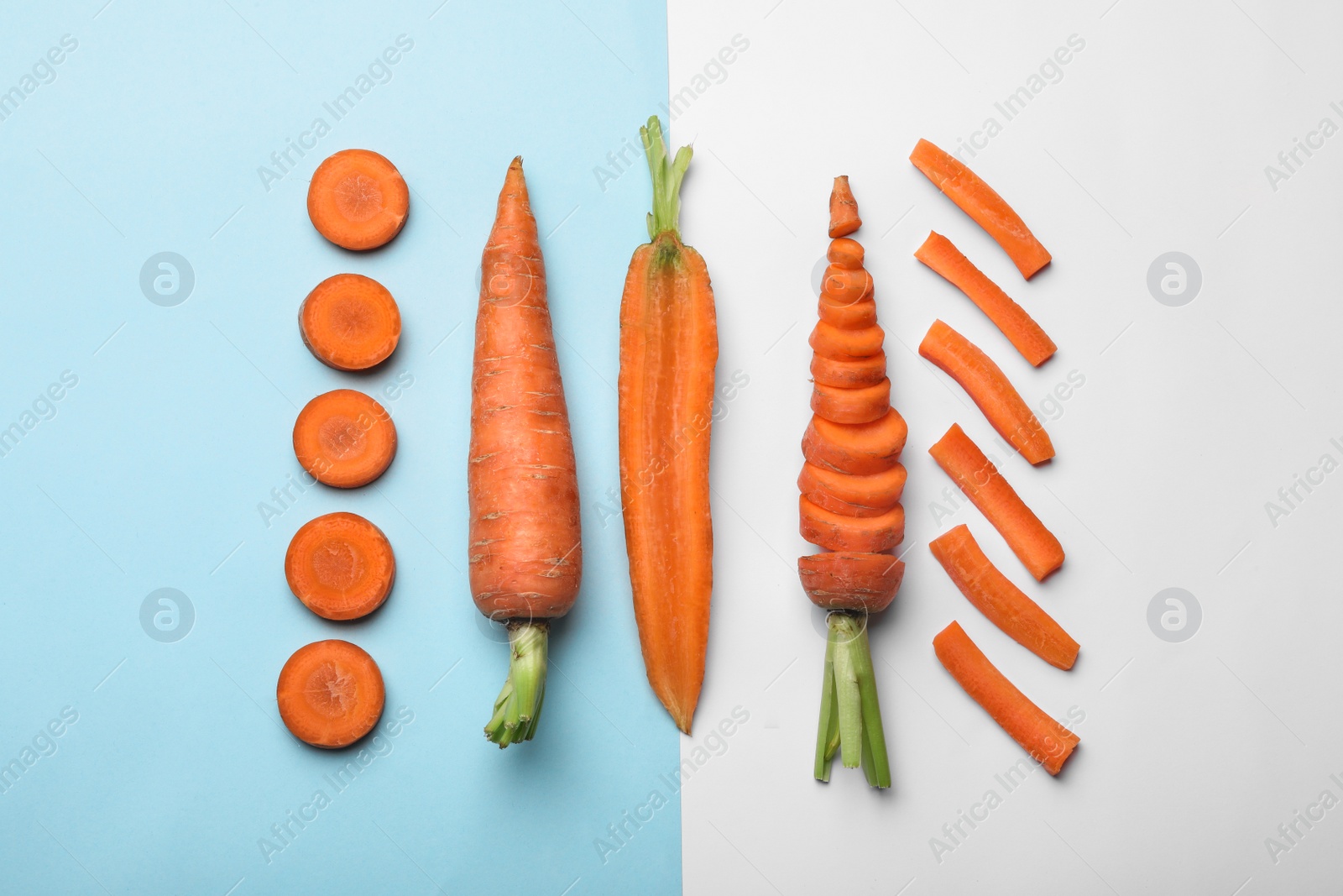 Photo of Flat lay composition with fresh sliced carrots on color background