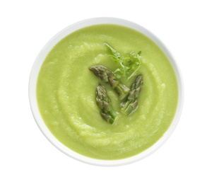 Delicious asparagus soup with arugula isolated on white, top view