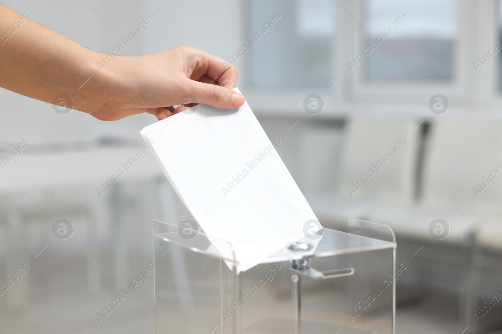 Photo of White ballot box on blurred background, closeup