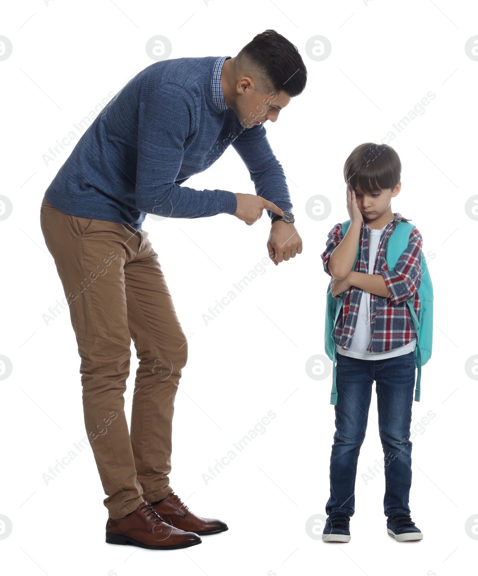 Photo of Teacher pointing on wrist watch while scolding pupil for being late against white background