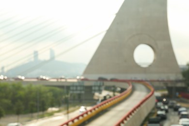 Photo of Blurred view of cars on modern bridge