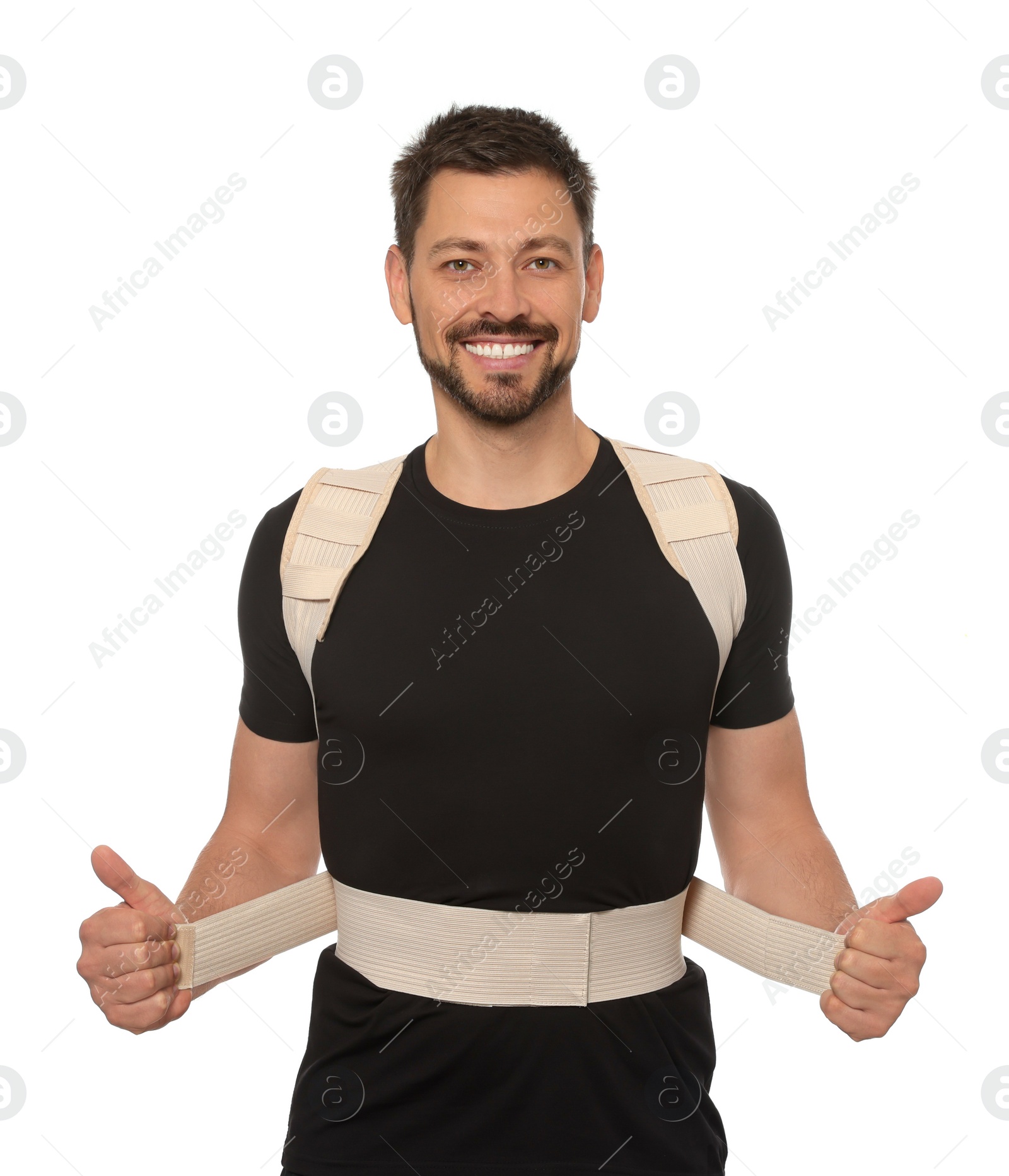 Photo of Handsome man with orthopedic corset on white background