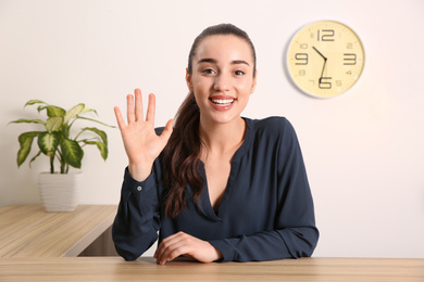 Photo of Young woman using video chat indoors, view from web camera