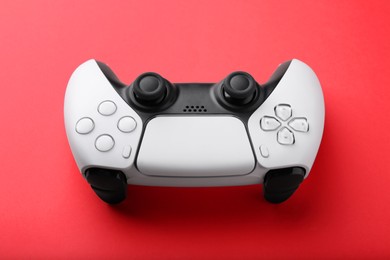 One wireless game controller on red background