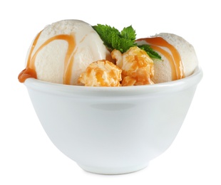 Photo of Delicious ice cream with caramel sauce, mint and popcorn in bowl on white background